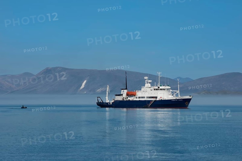 Tourist boat anchored in front of Yttygran Island