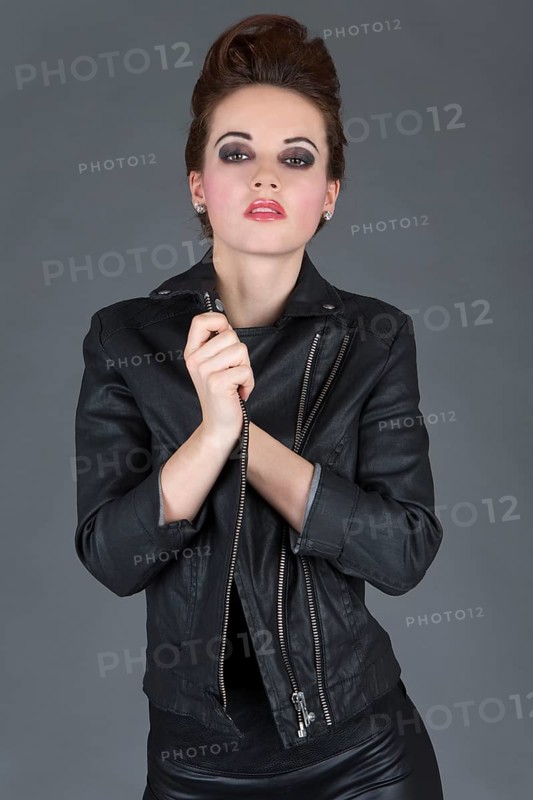 Young woman wearing a leather outfit