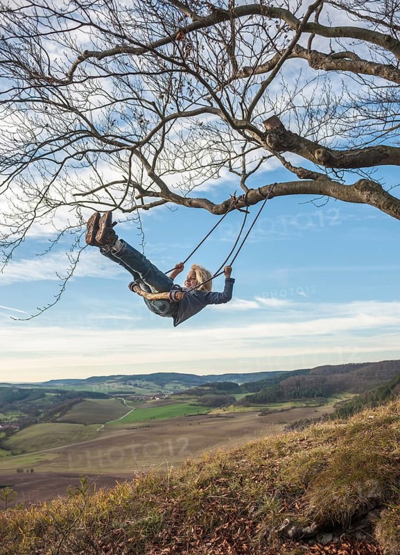 Boy on an improvised swing