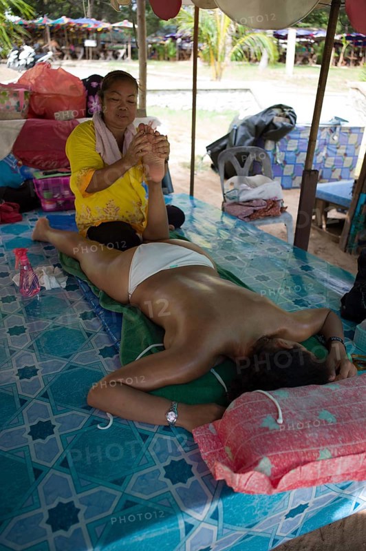 Traditional Thai massage at a beach