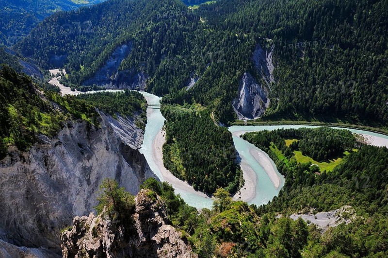 River bend of the Vorderrhein with railway bridge of the Rhaetian Railway