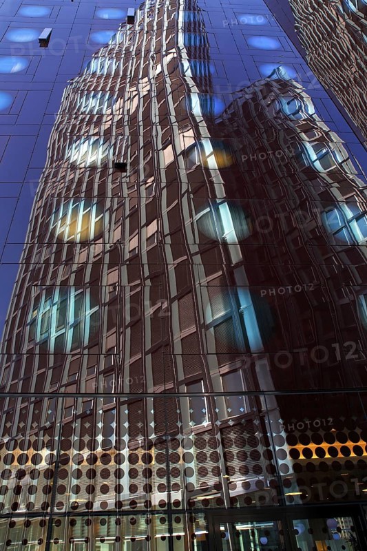 Tanzende Turme office building reflected in the facade of the Arcotel Onyx Hotel