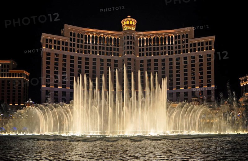 Bellagio Hotel and Casino with dancing water fountain show at night