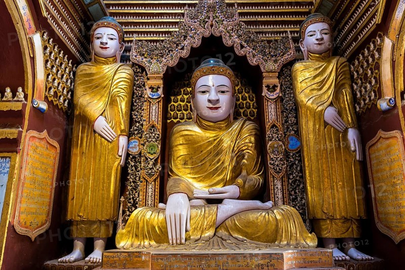 Seated and standing Buddha statues
