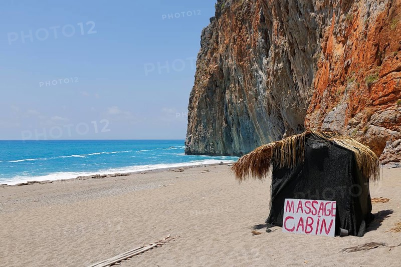 Hut with sign 'Massage Cabin' on the beach of Gazipasa