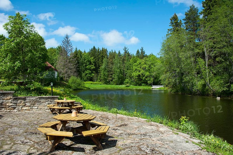 Tables and benches by the lake