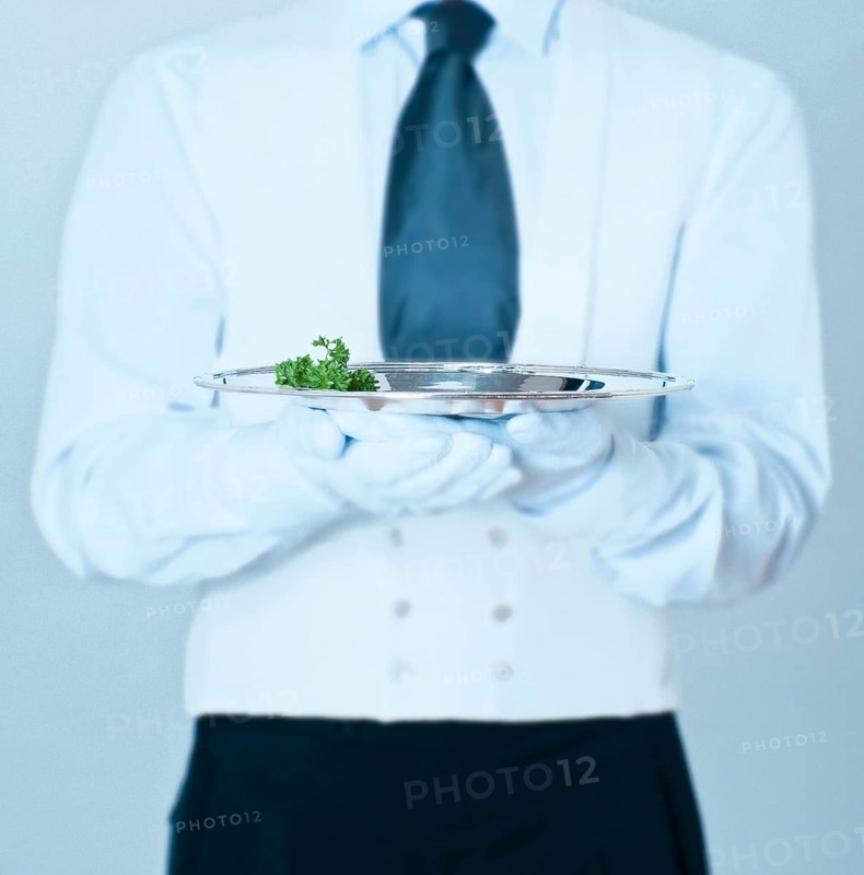Waiter holding a silver tray