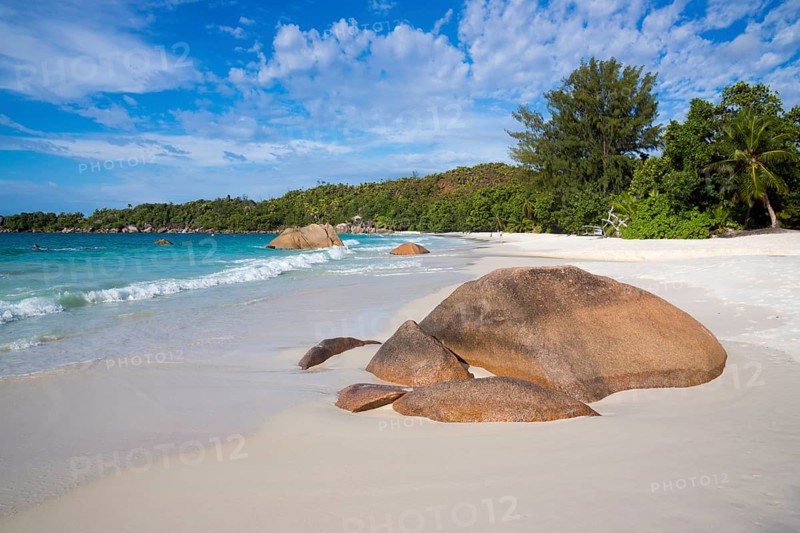 Sandy beach with the typical rock formations of the Seychelles