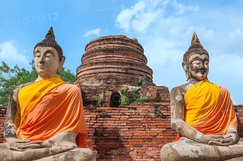 Buddha statues next to the central stupa