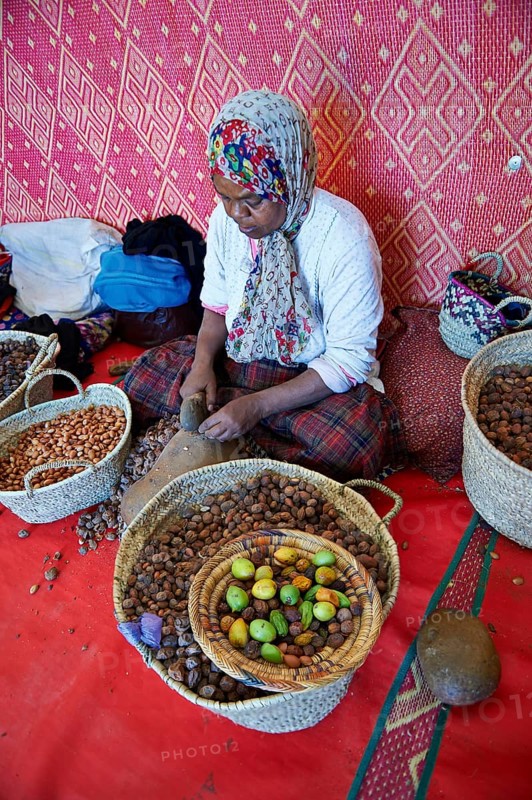 Women cracking argan nuts at the Cooperative Marjana