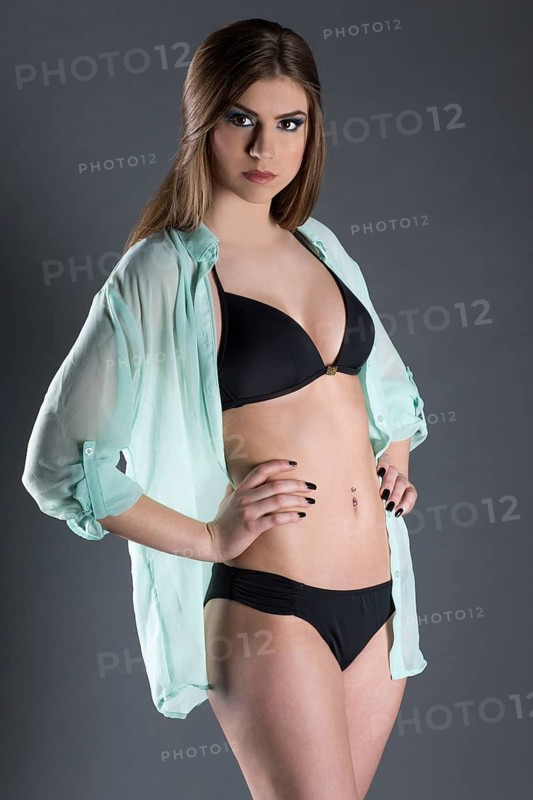 Young woman wearing a black bikini