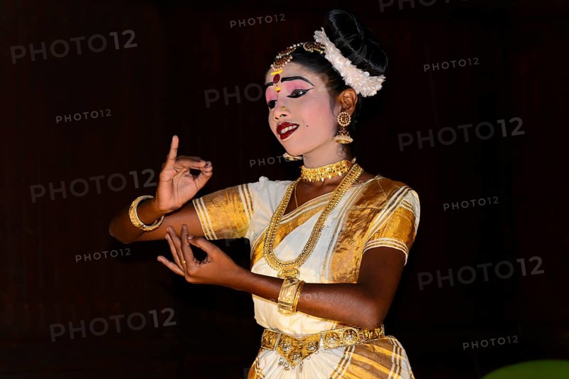 Fully made-up and costumed Kathakali dancer during a performance
