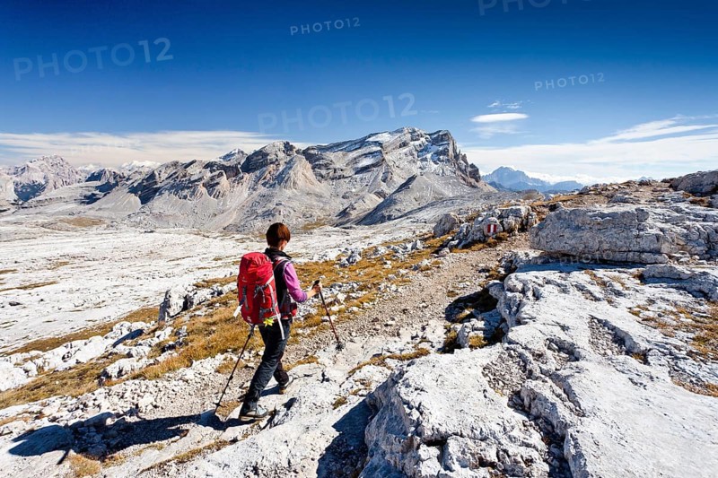 Mountain climber descending along the Heiligkreuzkofelsteig climbing route from Heiligkreuzkofel Mountain in the Fanes Group in the Fanes-Senes-Prags Nature Park