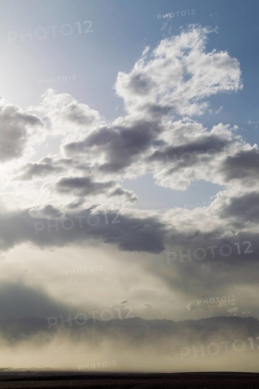 A sand storm over the Mesquite Flat Sand Dunes and the Panamint Range in the evening