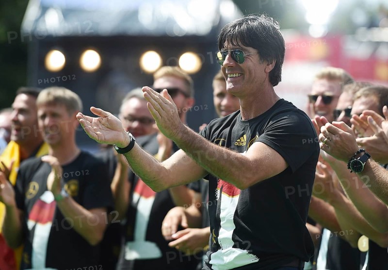 Joachim Low celebrates with fans