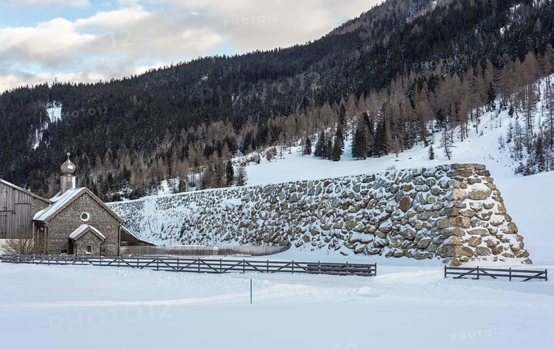 Stone wall as protection against avalanches