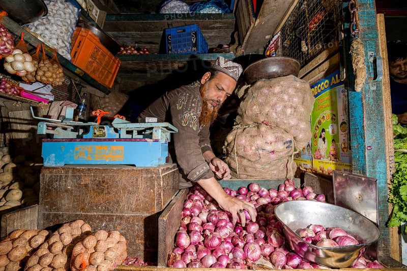 Man selling potatoes and onions at Crawfort Market