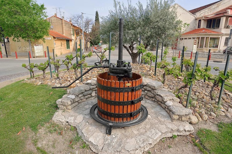 Old wine press in a roundabout