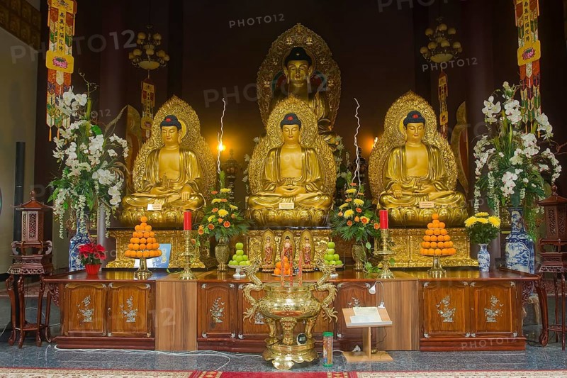 Buddha statues with an altar in Linh Thuu Pagoda