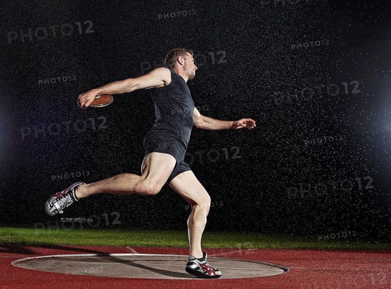 Discus thrower spinning before a throw
