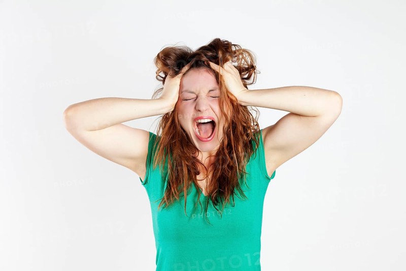 Desperate young woman screaming