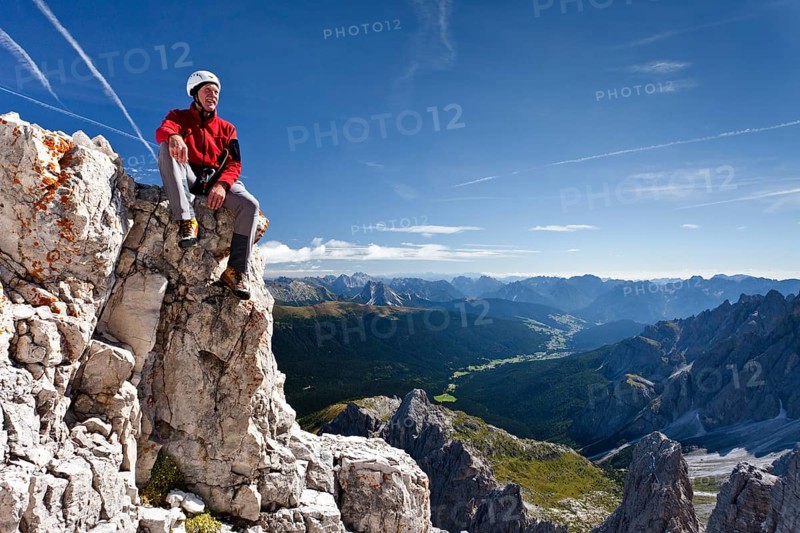 Climber on top of the Croda Rossa di Sesto in the Dolomites of Sesto
