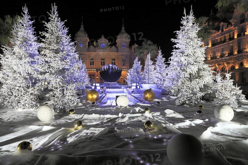 Christmas decorations with white fir trees on the square in front of the Monte Carlo Casino