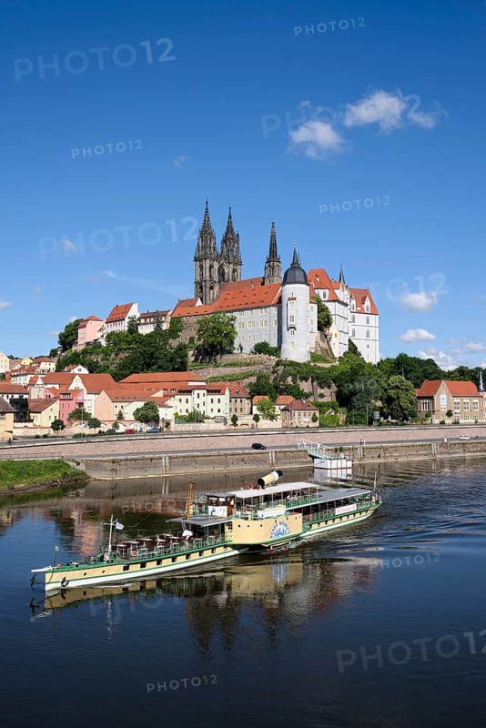 Paddle wheel steamer on the Elbe river in front of Albrecht Castle with the cathedral of Meissen