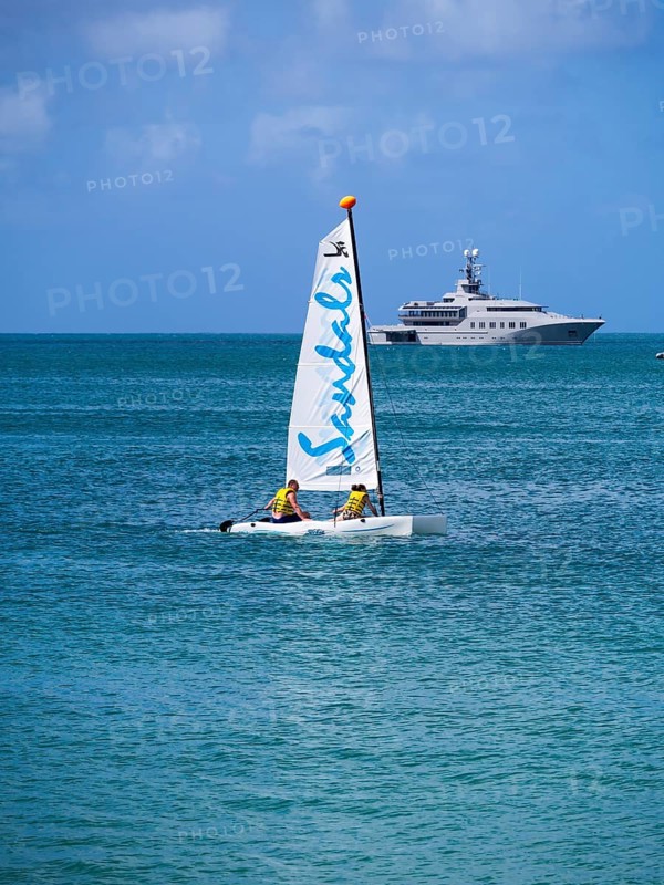 Catamaran and a motor yacht in Rodney Bay
