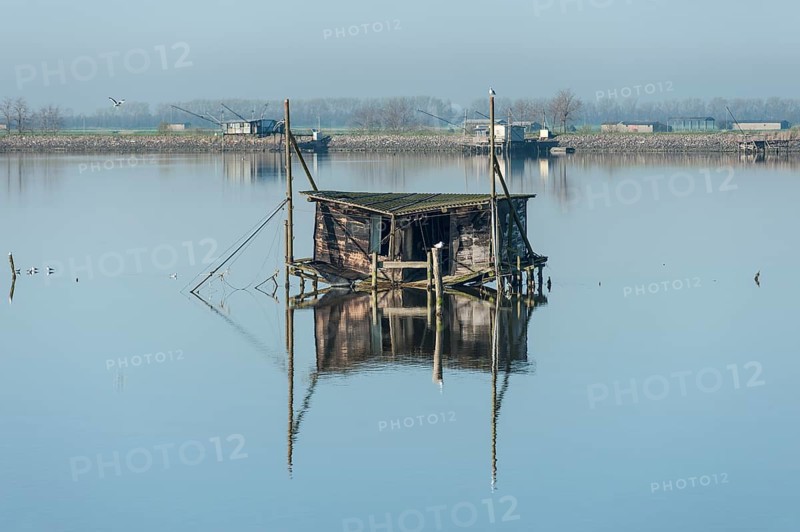Dilapidated fishing hut in a lagoon