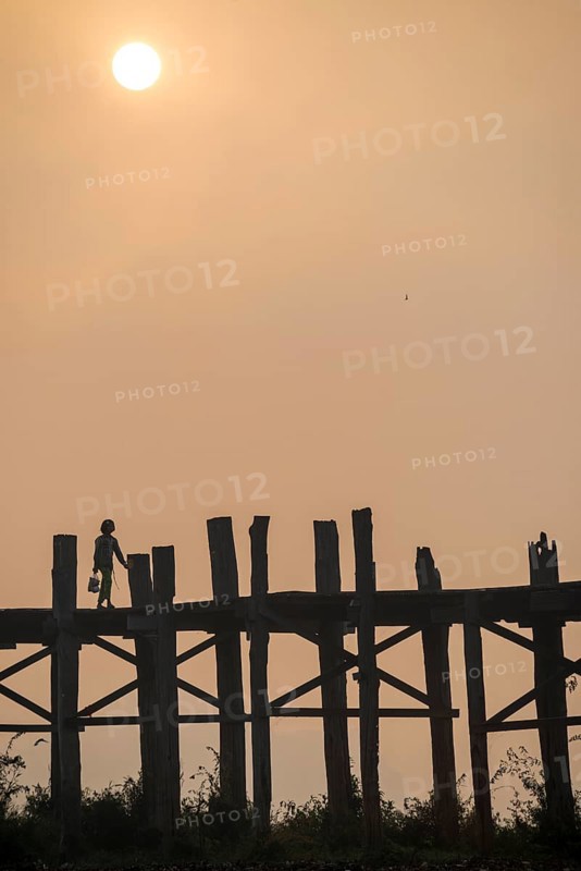 Locals on a teak bridge