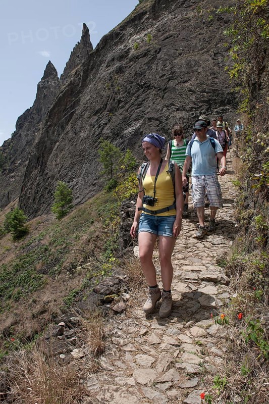 Hikers on a trail on the steep slopes of the Paul Valley