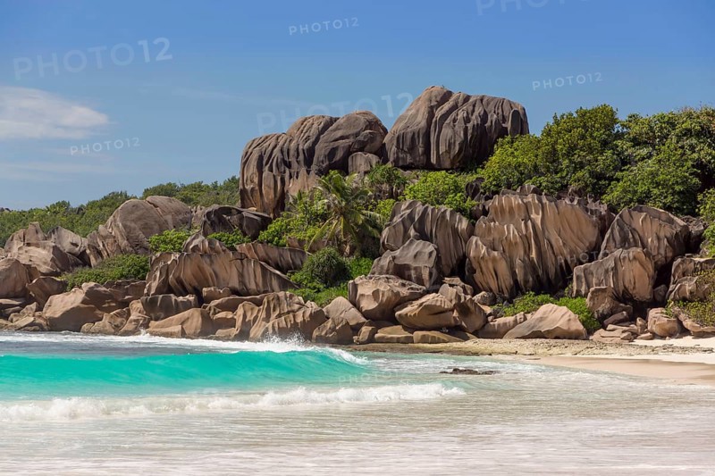 Sandy beach with the rock formations typical for the Seychelles