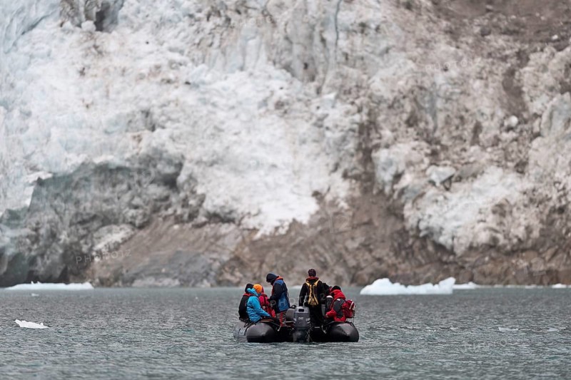 Tourists and guides in an inflatable boat