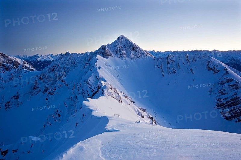 Frozen north face of Reitherspitze Mountain at dusk