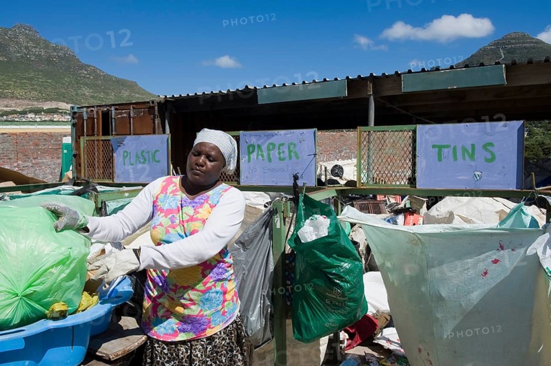 Woman working at a collecting point for recycling