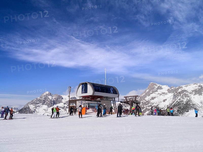 Skiers at the chairlift station