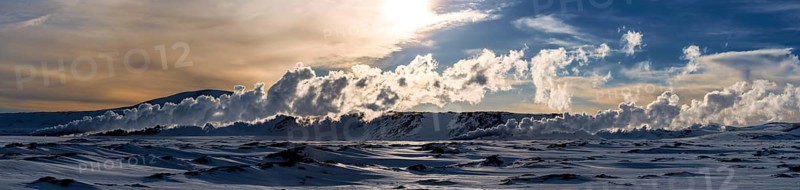 Geyser in a snow-covered landscape