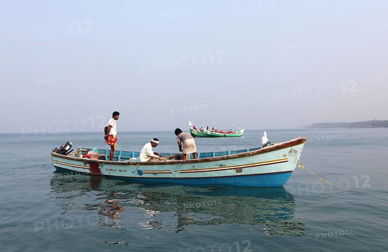 Local mussel fishermen in their boat off the coast