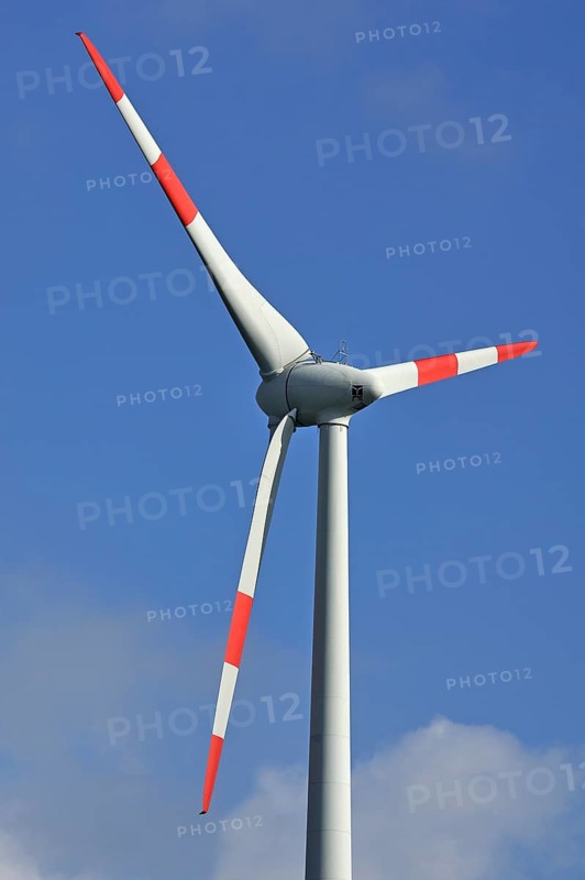 Wind turbine against blue sky