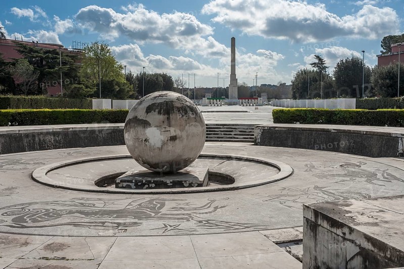 Stone globe and square with marble mosaics