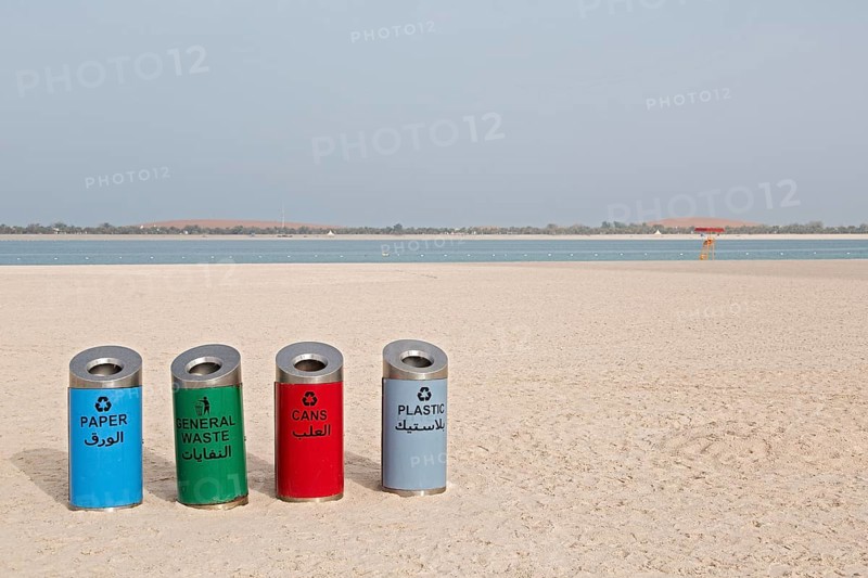 Rubbish bins for sorting waste on the beach at Corniche Road