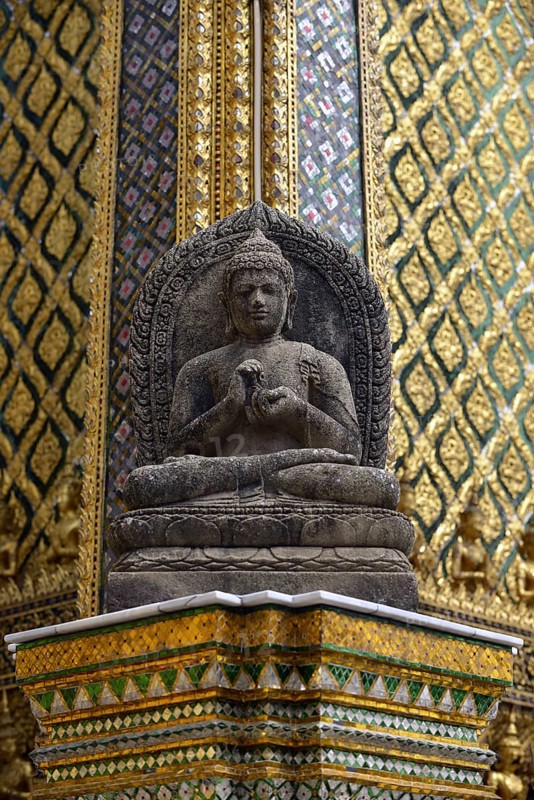 Buddha statue in front of the Mondop