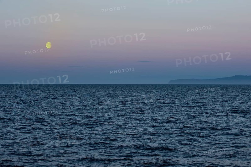 Moon setting over the Bering Strait