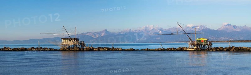 Fisherman's houses with nets over the sea in Marina di Pisa