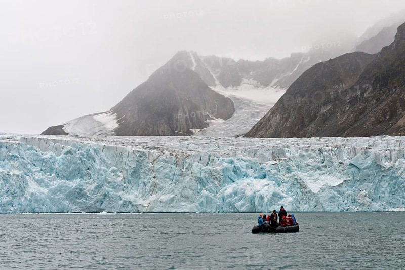 Tourists and guides in an inflatable boat