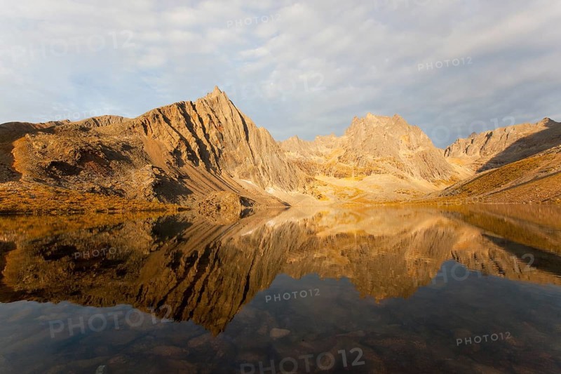 Reflection of Mount Monolith in calm Grizzly Lake