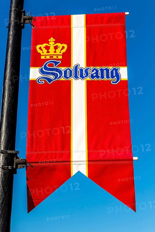 Flag of Denmark hanging on a lamppost in Solvang