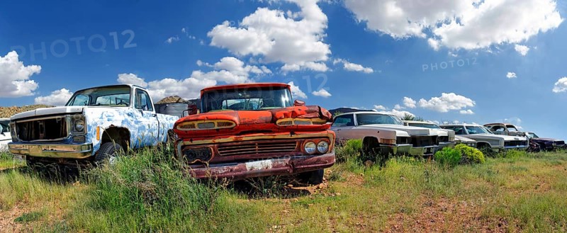 Junk yard with old American cars