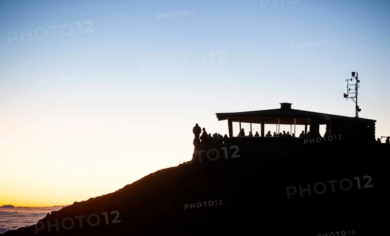 Tourists awaiting the sunrise on the summit of the Haleakala volcano